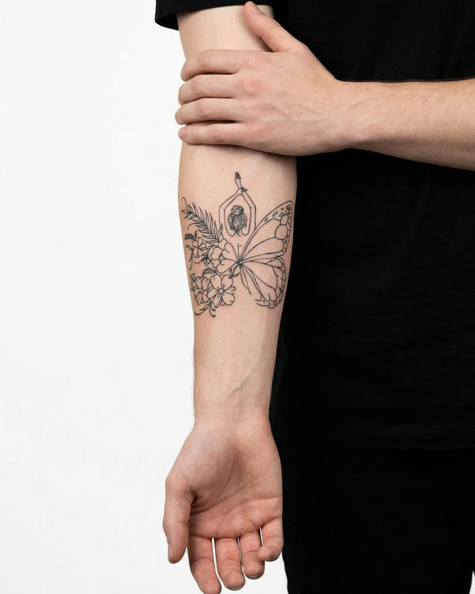 INKON Mujer Mariposa Floral tatuaje semi-permanente aplicado en un hombre – diseño de 4 x 4 in (9x9cm), apariencia de tinta realista, dura 10 días